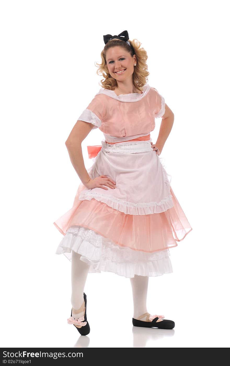 Ballerina wearing a pink dress and isolated on a white background. Ballerina wearing a pink dress and isolated on a white background