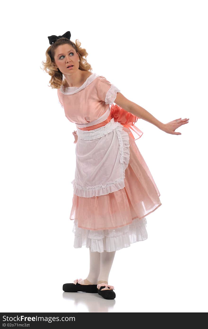 Ballerina wearing a pink dress and isolated on a white background. Ballerina wearing a pink dress and isolated on a white background