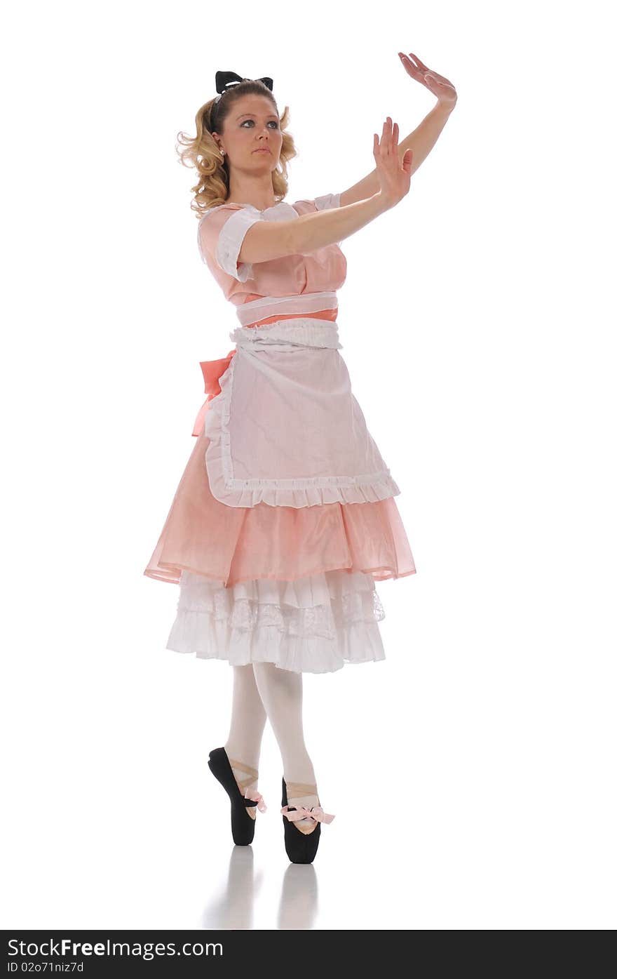 Ballerina wearing a pink dress and isolated on a white background. Ballerina wearing a pink dress and isolated on a white background