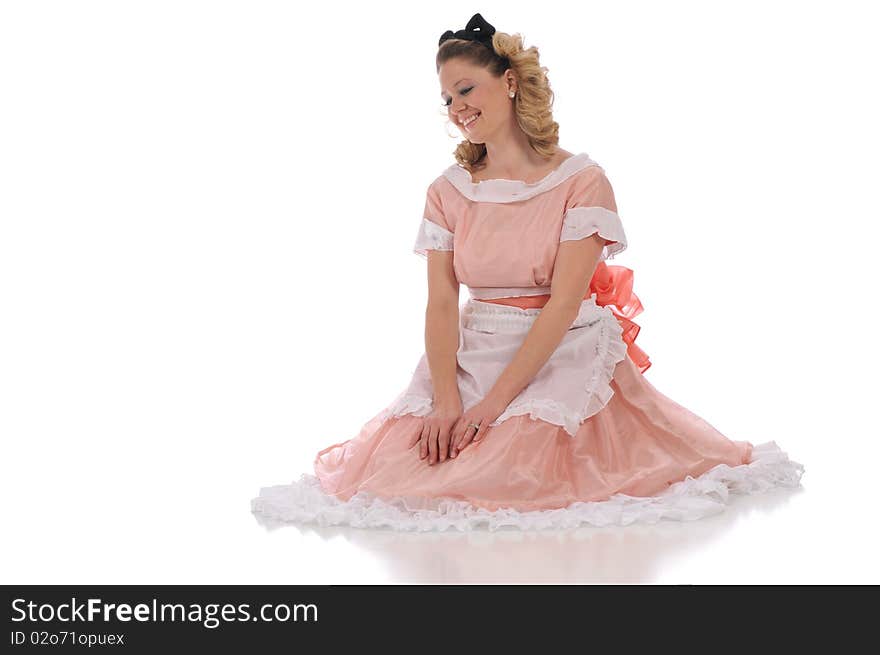 Ballerina wearing a pink dress and isolated on a white background. Ballerina wearing a pink dress and isolated on a white background