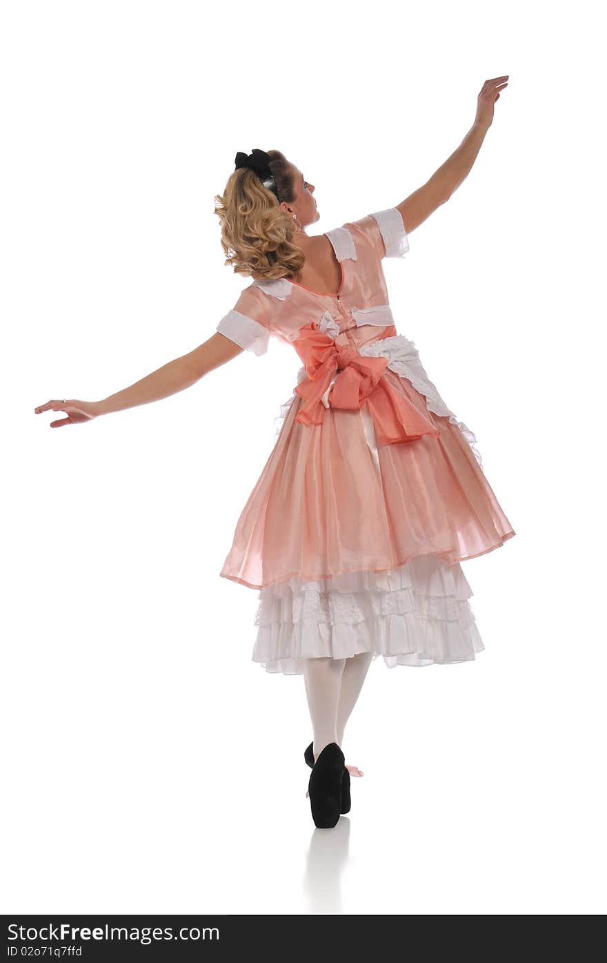 Ballerina wearing a pink dress and isolated on a white background. Ballerina wearing a pink dress and isolated on a white background