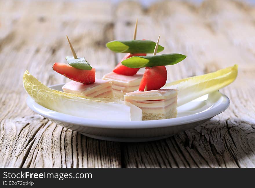 Ham and cheese canapes and endive - detail