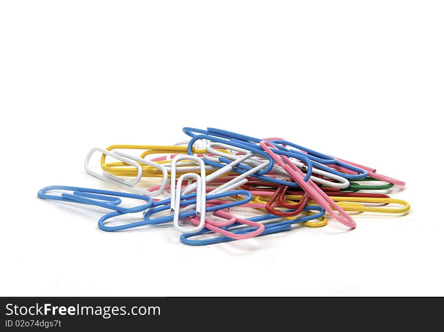 Stack of brightly coloured paper clips isolated on white background. Stack of brightly coloured paper clips isolated on white background