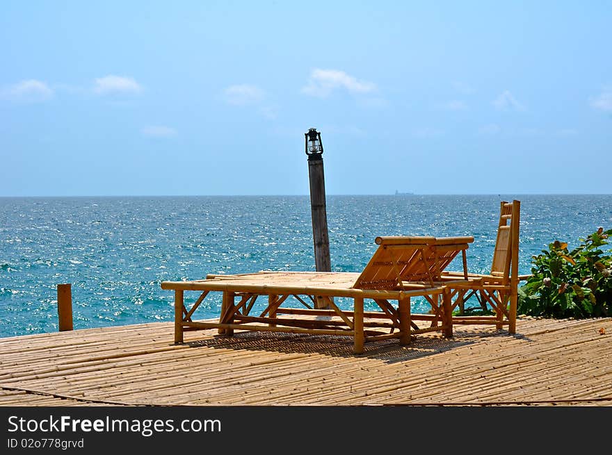 Bamboo chairs near sea