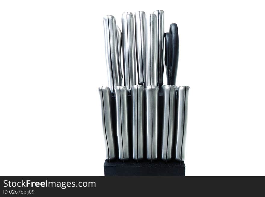 Handles of knifes in the holder are isolated on a white background