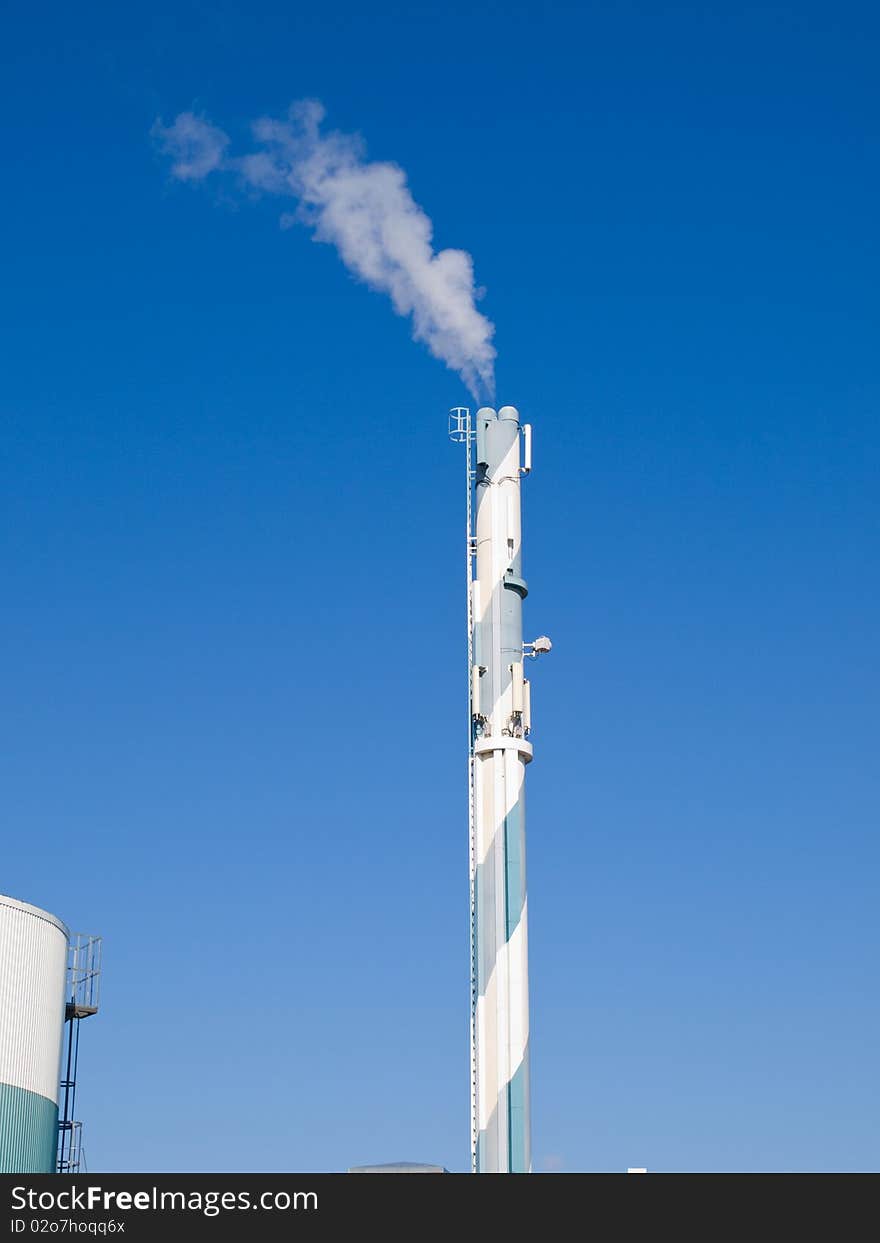 Factory plant building with a chimney modern industry background vertical. Factory plant building with a chimney modern industry background vertical