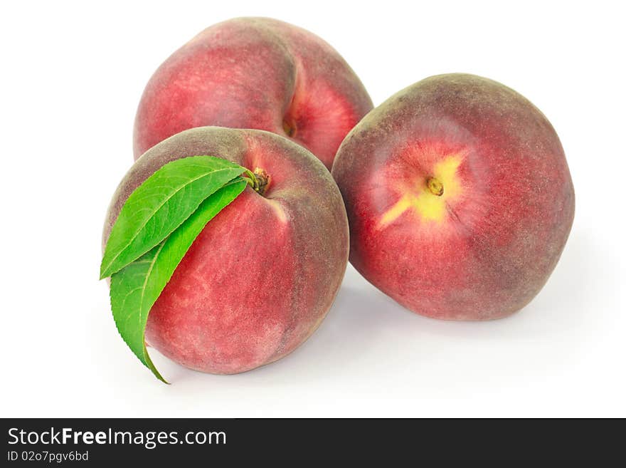 Three peaches isolated on white