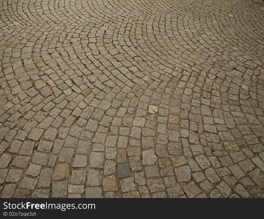 Stone as raw material for the construction of roads, streets, sidewalks, and background and texture