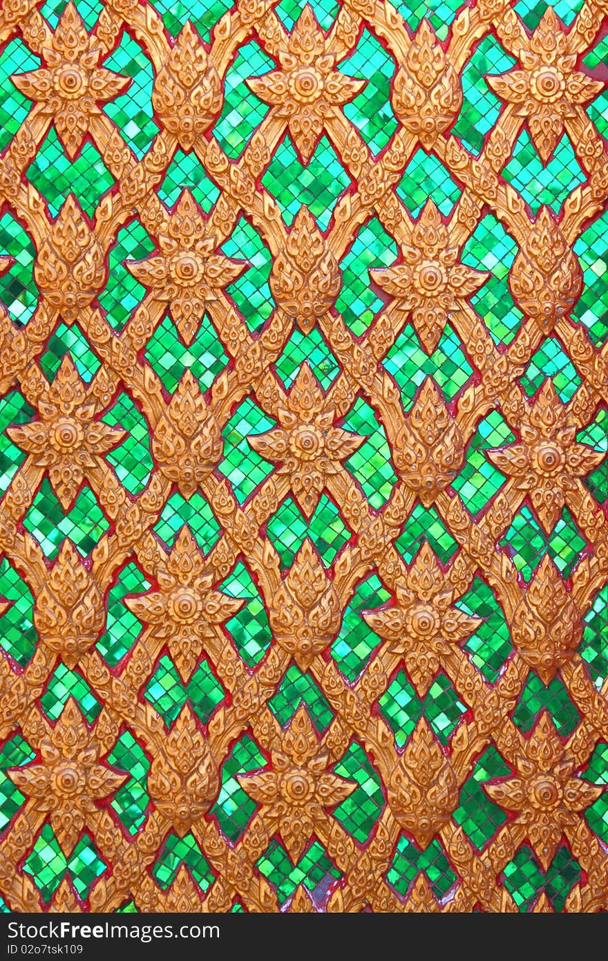 Traditional Thai art  pattern, molding with green glass technique.