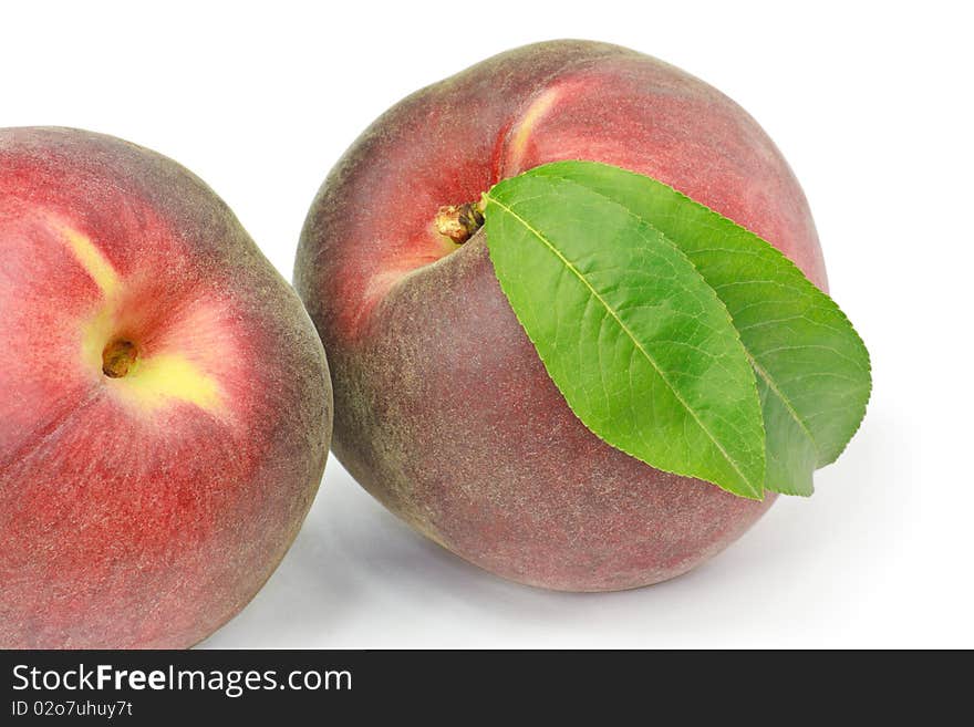 Two peaches isolated on white