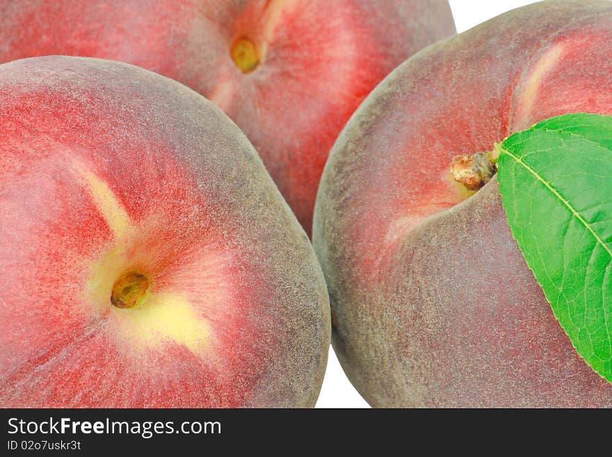 Three peaches isolated on white