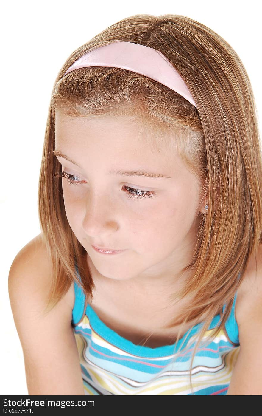 Closeup of a very pretty young girl with blond hair, looking away from the camera, on white background. Closeup of a very pretty young girl with blond hair, looking away from the camera, on white background.