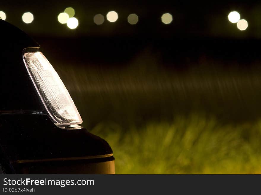 Car headlight at night, long exposure photography