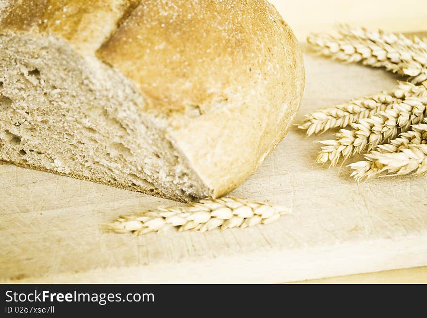 Bread and ears of wheat close up shot