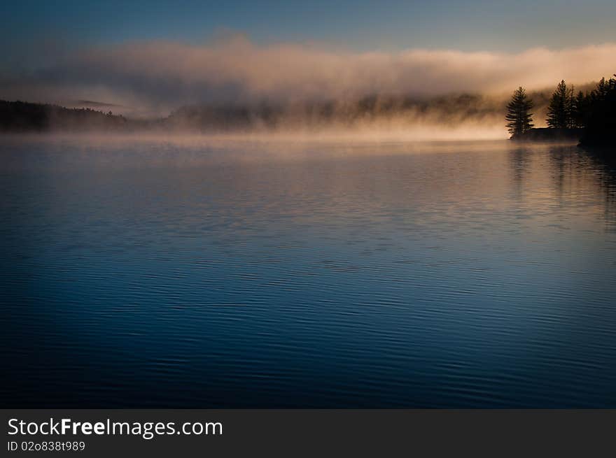 This is a twilight on a lake soon in the morning. This is a twilight on a lake soon in the morning.