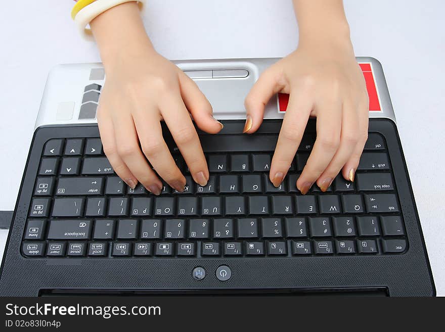 Someone is working with laptop on the table. Someone is working with laptop on the table