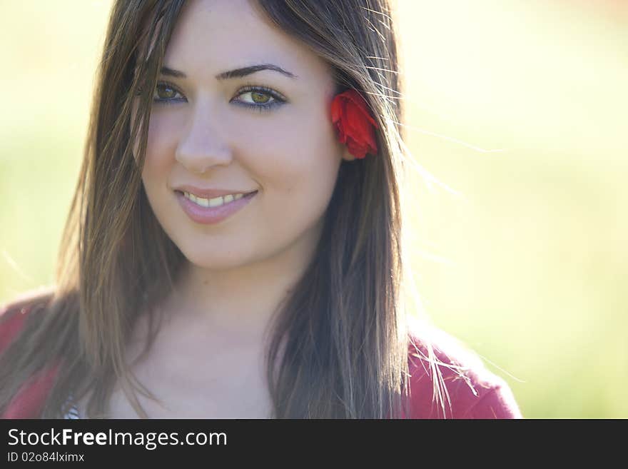 Young beautiful girl staring at camera. Backlit light. Young beautiful girl staring at camera. Backlit light.