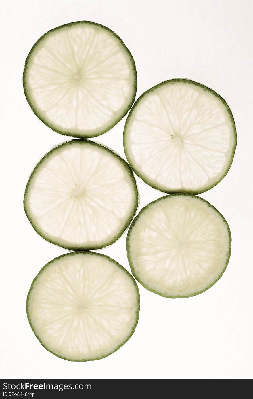 Limes slices on white background