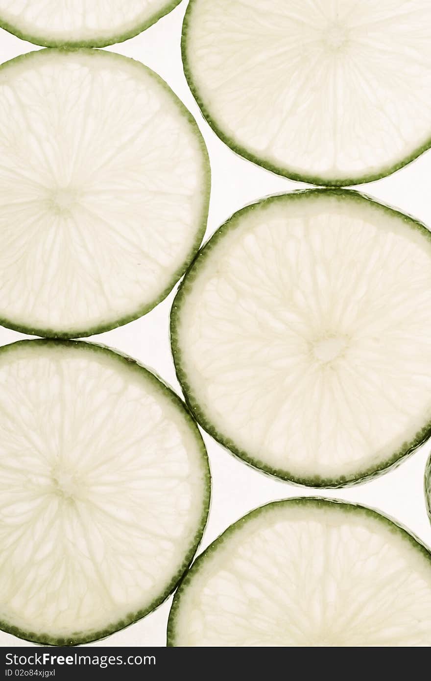 Limes slices on white background