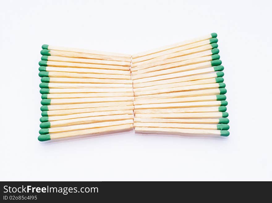 Matches with green tips on white background