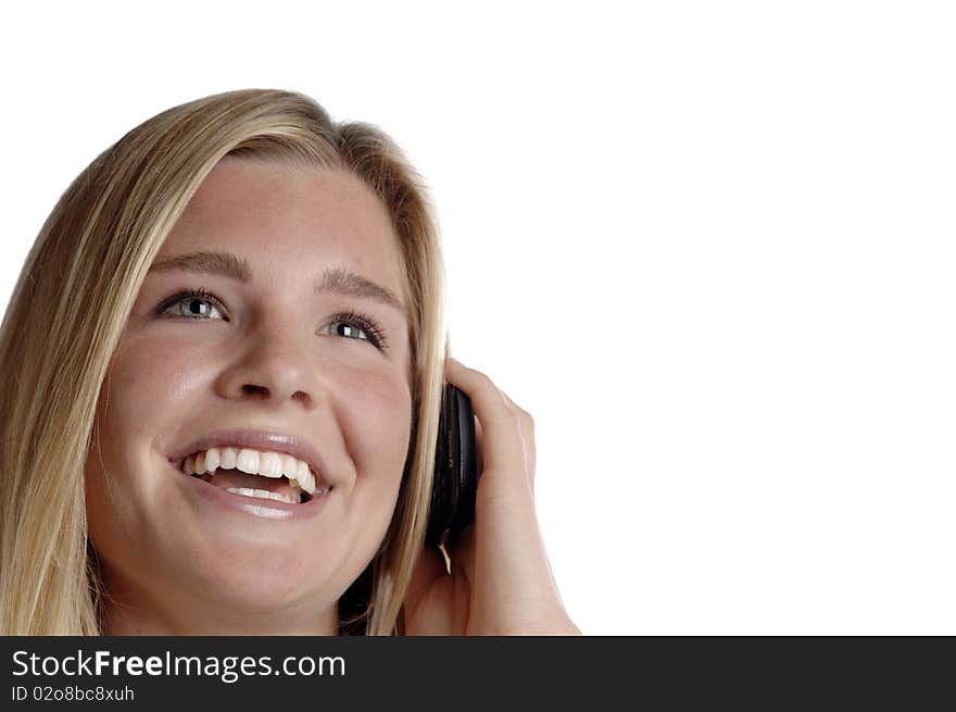 Young energetic business woman smiles as she talks on her cell phone. Young energetic business woman smiles as she talks on her cell phone.