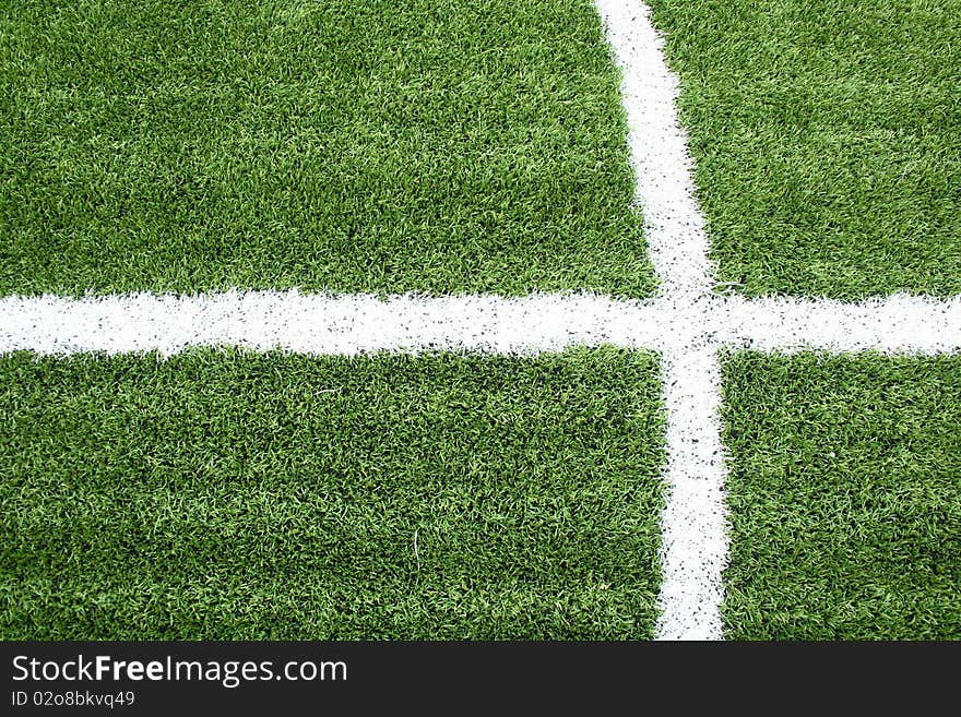 Soccer field with white lines on grass