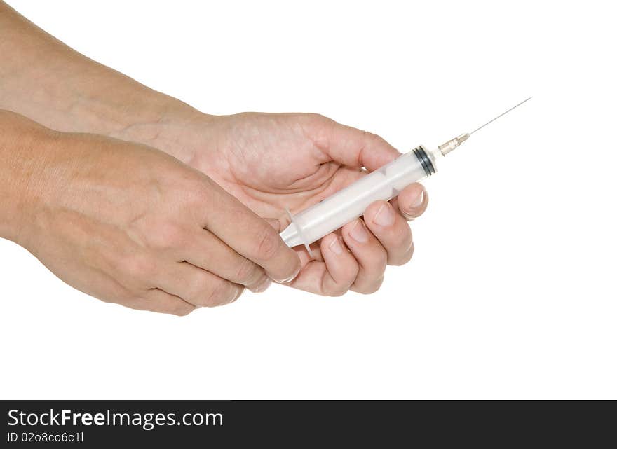 Syringe in his hand on a white background