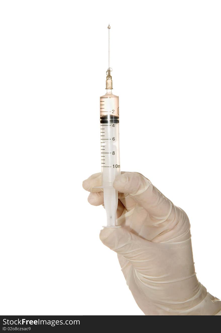 Syringe in his hand on a white background