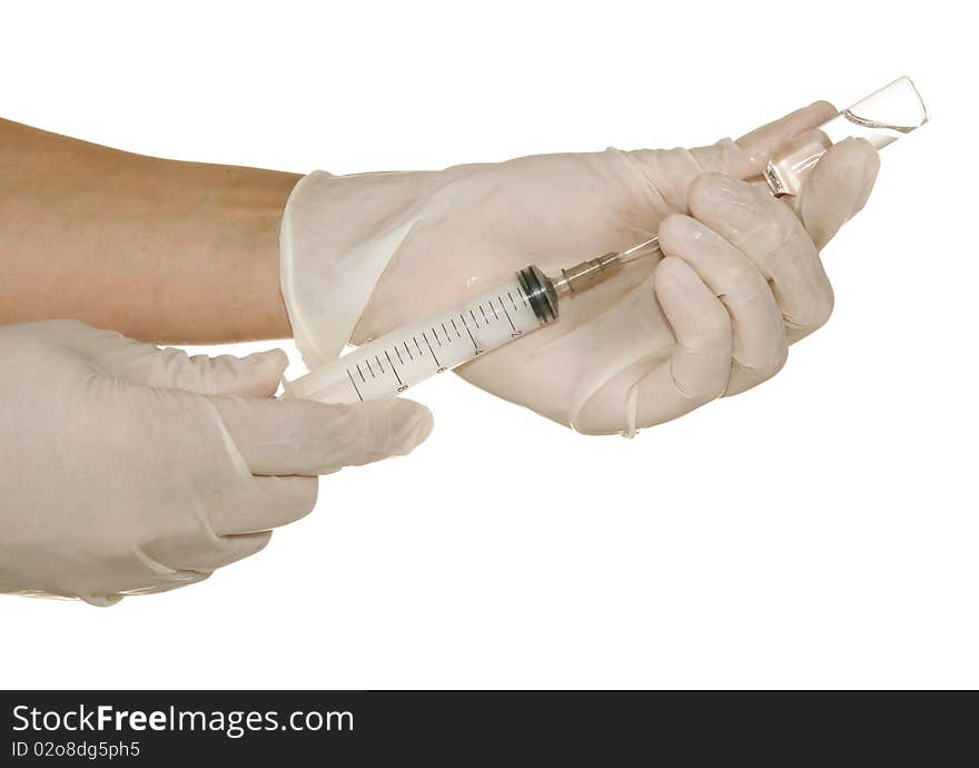 Syringe in his hand on a white background