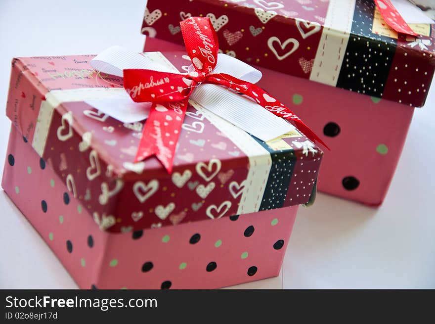 Two gift boxes with ribbon isolated on white background - Shallow depth of field - Focus on bow