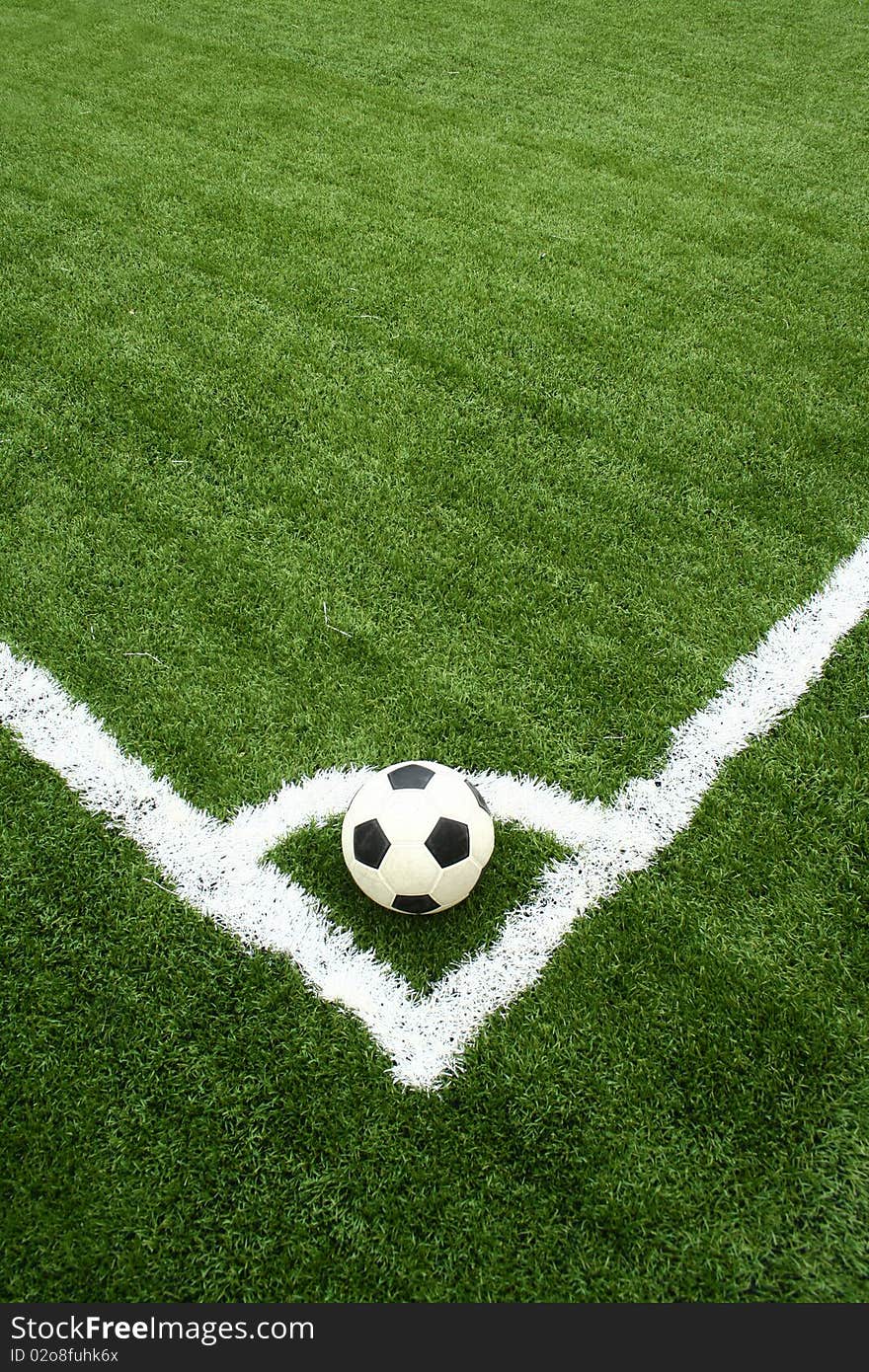 Corner kick on green grass