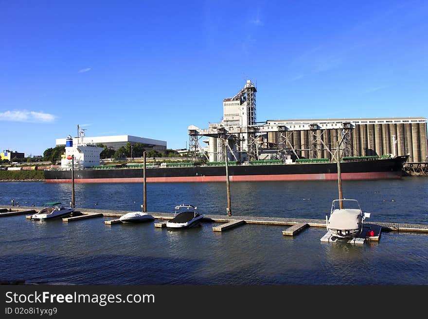 Cargo ship & grain elevator.