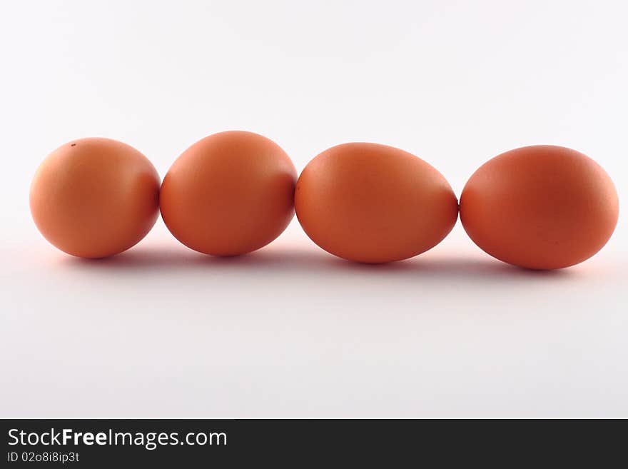 Four brown eggs isolated on a white background. Four brown eggs isolated on a white background