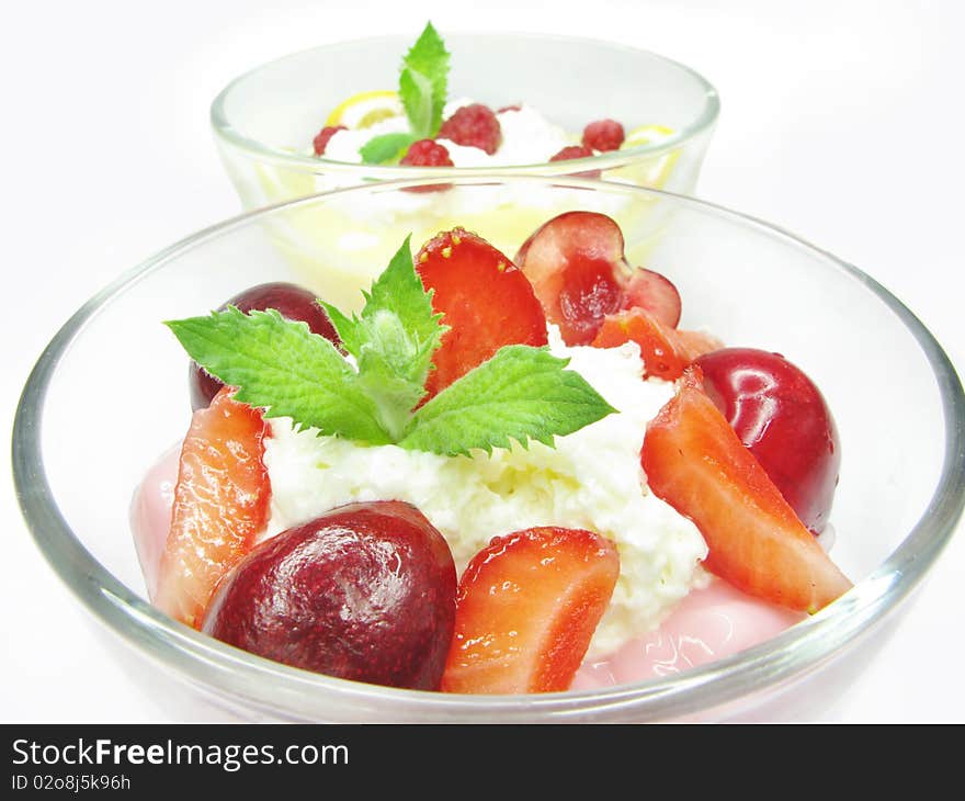 Strawberry mousse dessert with cherry and raspberry
