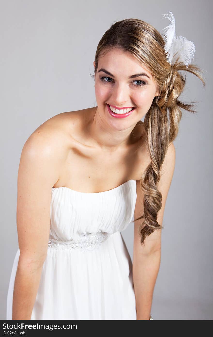 Attractive Young Woman in a White Dress