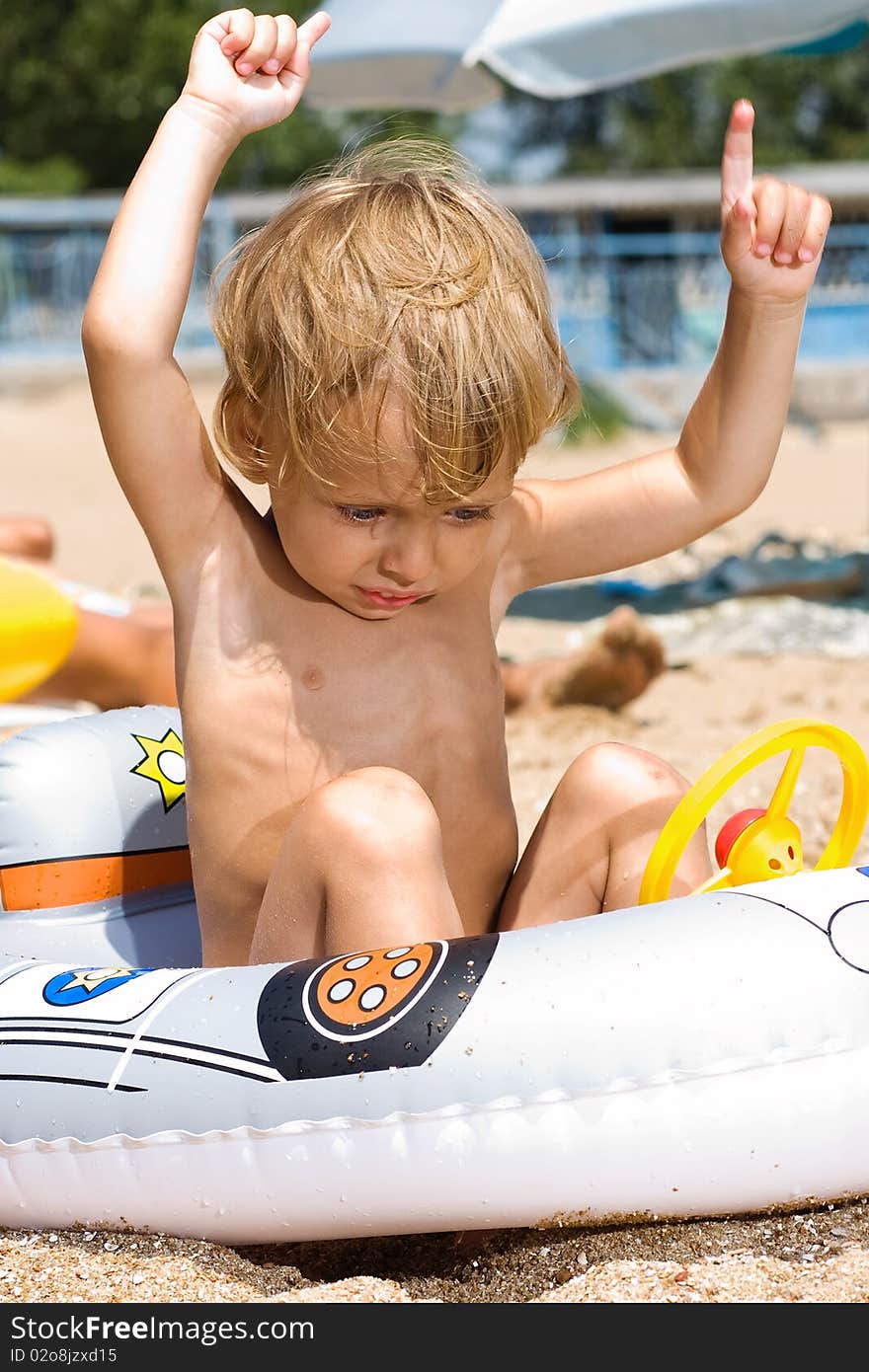 Little boy plays at the beach