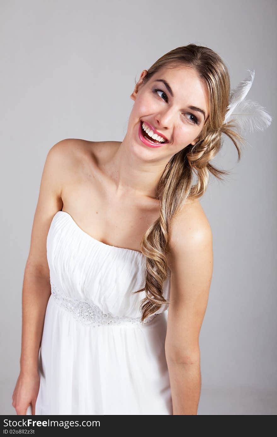 Attractive Young Woman in a White Dress