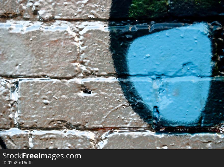 Graffiti detail on the textured Brick Wall. Graffiti detail on the textured Brick Wall