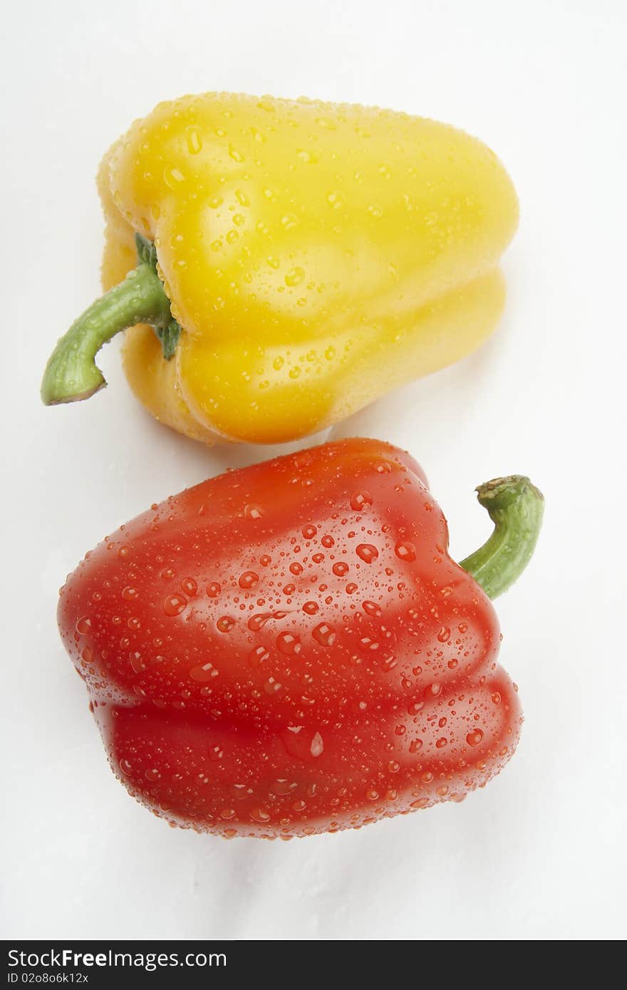 Ripe Yellow and Red Paprika Isolated on White Background