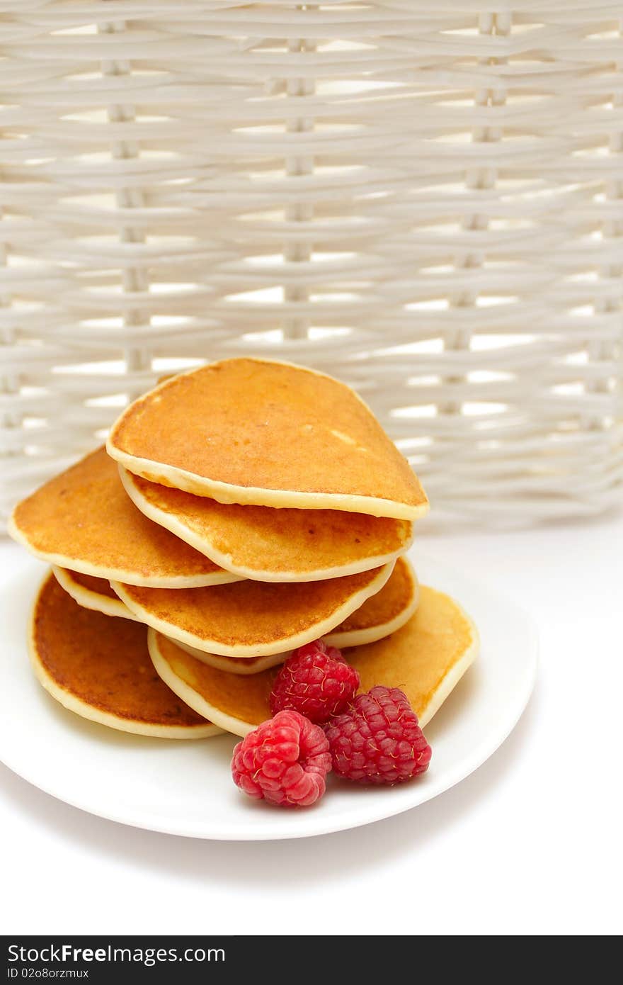 Small pancakes topped with berries