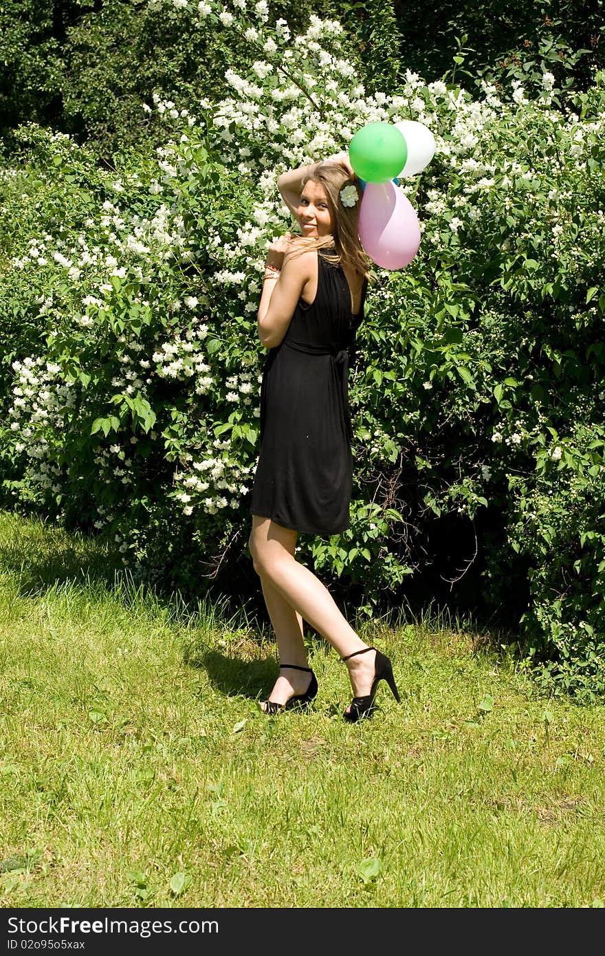 Joyful girl with balloons