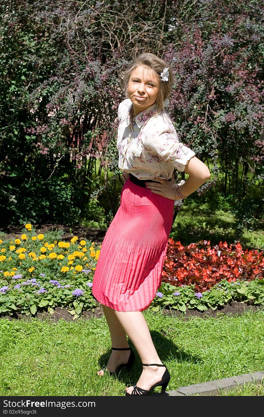 Girl standing in her garden. Girl standing in her garden