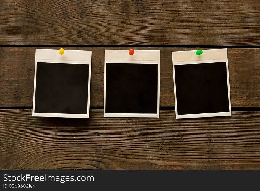 Photo-frameworks on a background of an old, wooden surface. Photo-frameworks on a background of an old, wooden surface