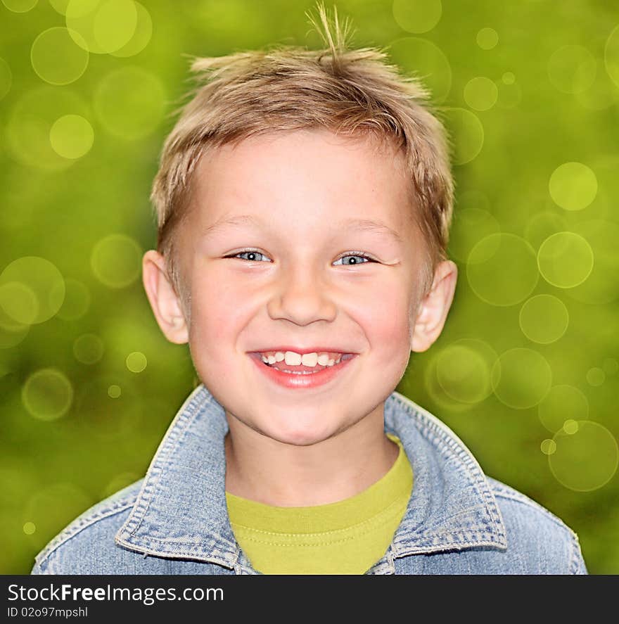 Happy boy on a green background