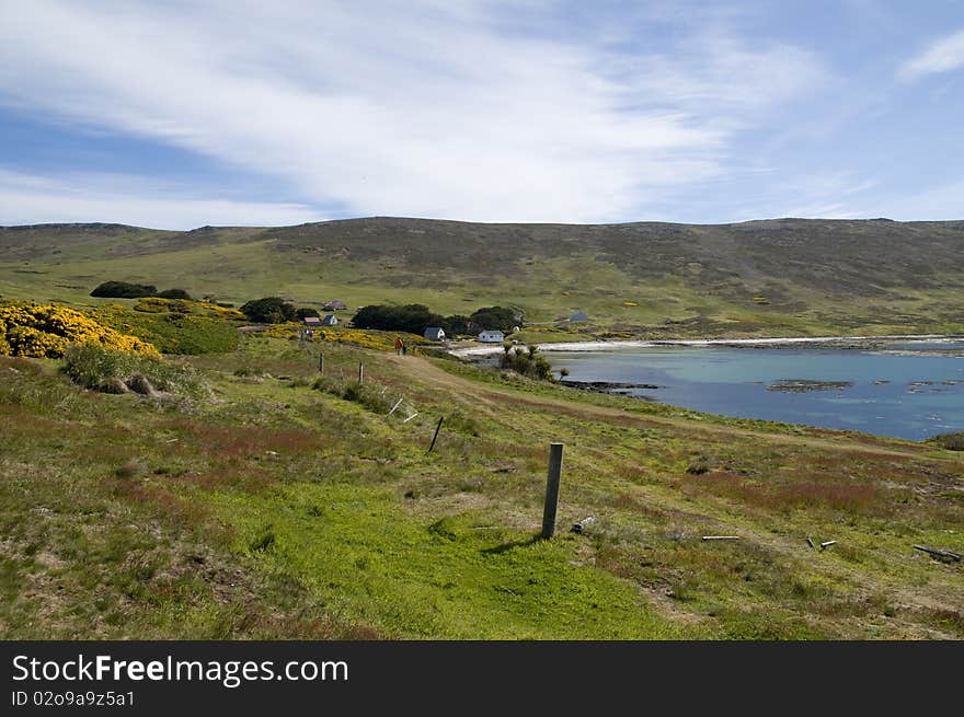 An isolated farm in a peaceful bay in the Falkland Islands. An isolated farm in a peaceful bay in the Falkland Islands.