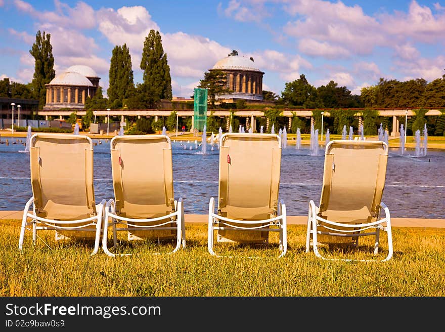 Deckchairs by the pond on a sunny day