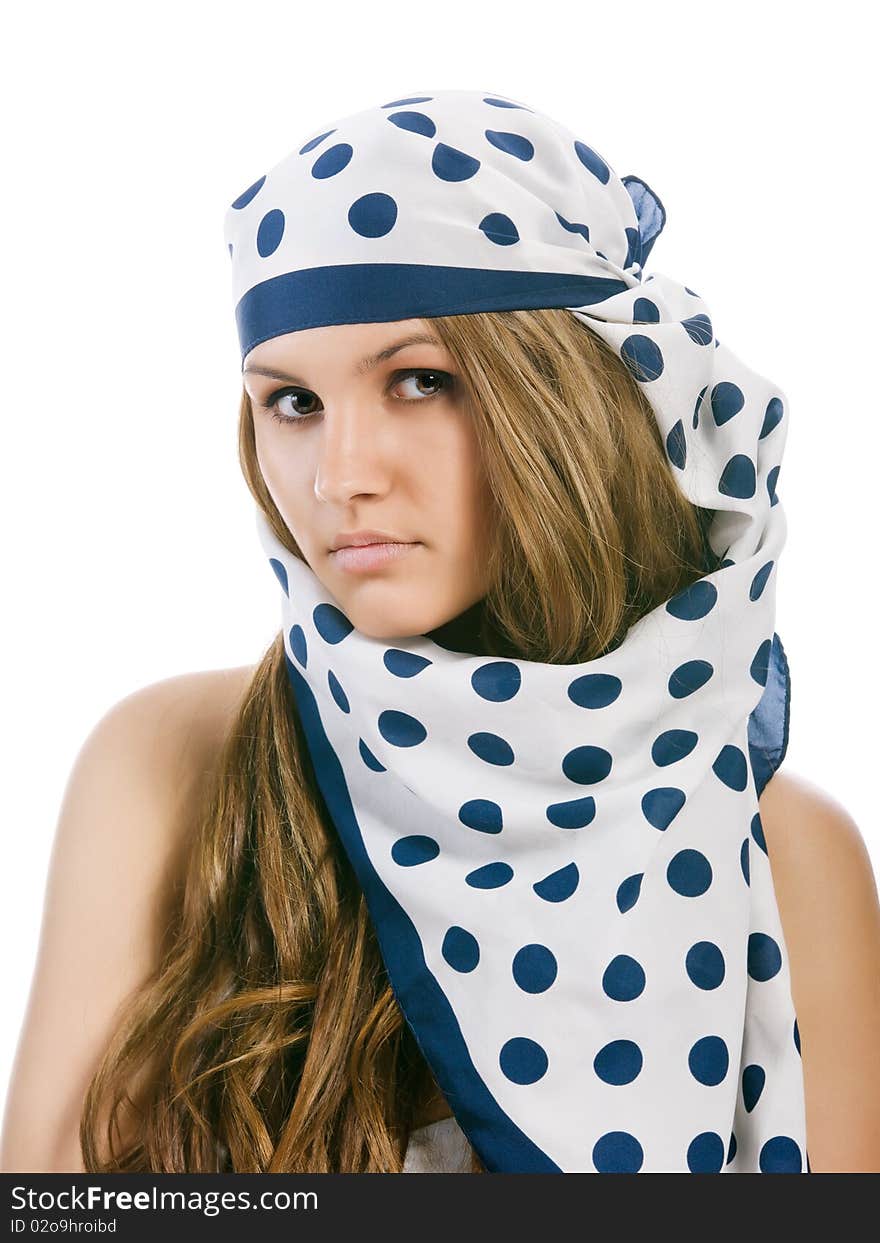 Young girl in blue polka dot kerchief looks at the camera. Young girl in blue polka dot kerchief looks at the camera