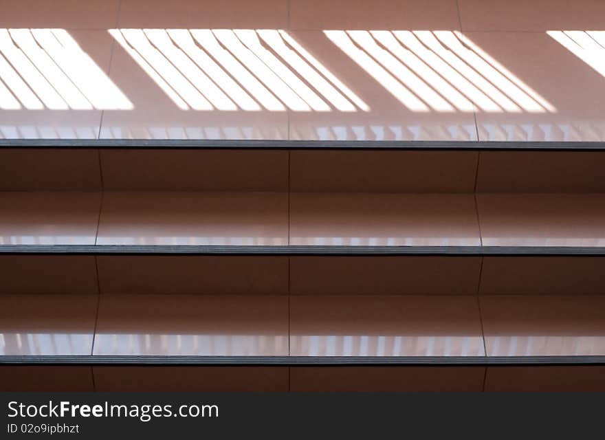 Ladder on an attic. Open staircase indoors. A corridor in office building.