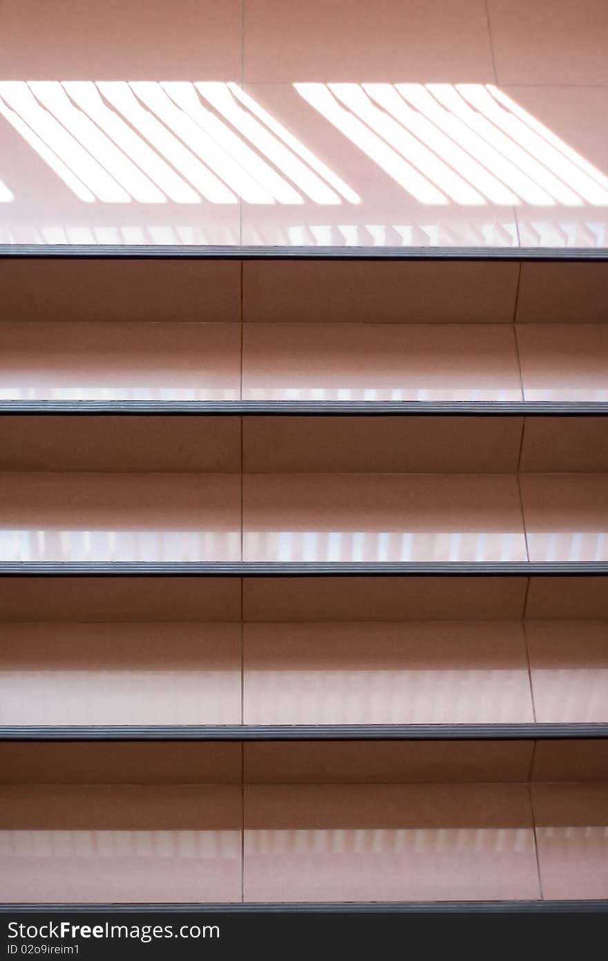 Ladder on an attic. Open staircase indoors. A corridor in office building.