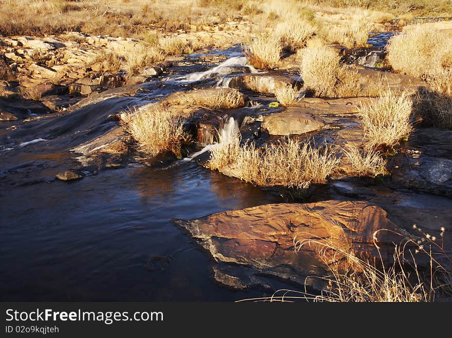 Autum late afternoon sunlight lights up a mountain stream. Autum late afternoon sunlight lights up a mountain stream